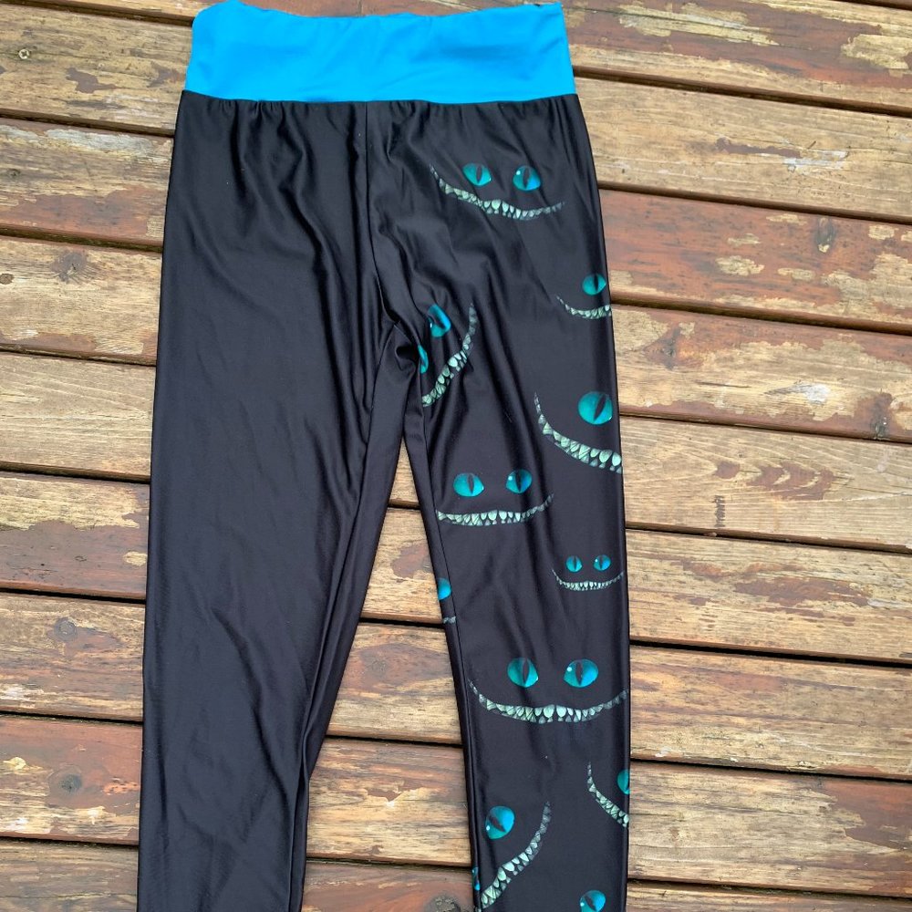 Black Shiny Leggings Ladies size Small with Dragon Eyes and Smiles